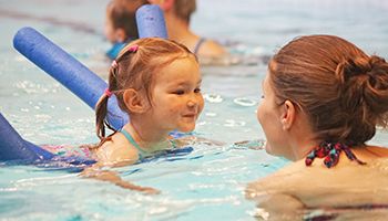 Parent and child swimming